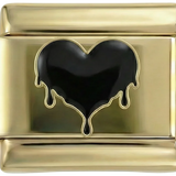 Corazón negro derretido sobre oro